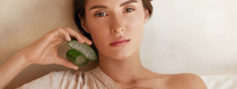 Beauty Portrait Of Woman With Aloe Vera Slices